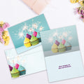 Load image into Gallery viewer, The inside of Tree-Free’s Cumpleanos Cupcakes card, with the cover and envelope in the background.
