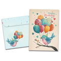 Load image into Gallery viewer, Cover of Balloons Flying By Birthday card (featuring script text above artwork of a bird sitting on a tree branch and holding several balloons in its beak) and its matching envelope
