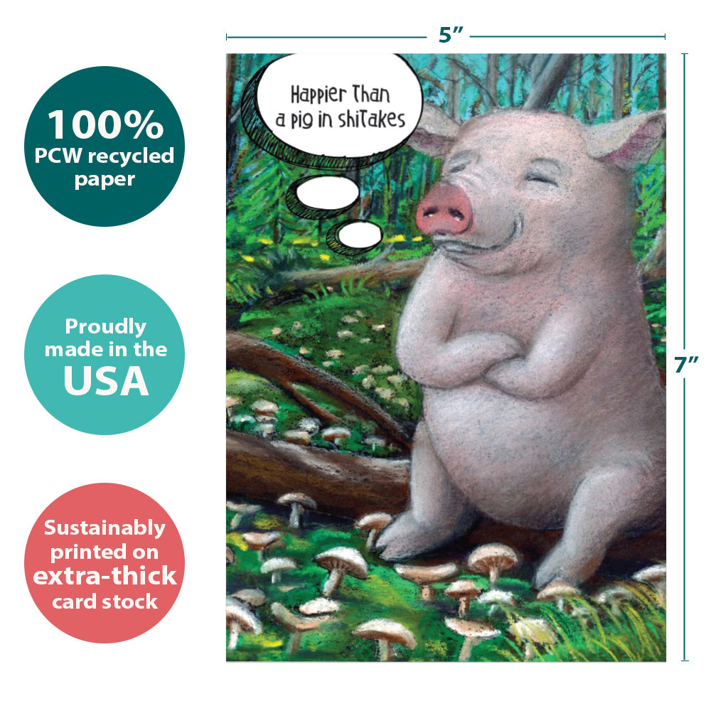 The cover of Tree-Free’s Pig in Shitakes card with lines demonstrating its 5x7 dimensions, along with the following text: “100% PCW recycled paper, proudly made in the USA, sustainably printed on extra-thick card stock”