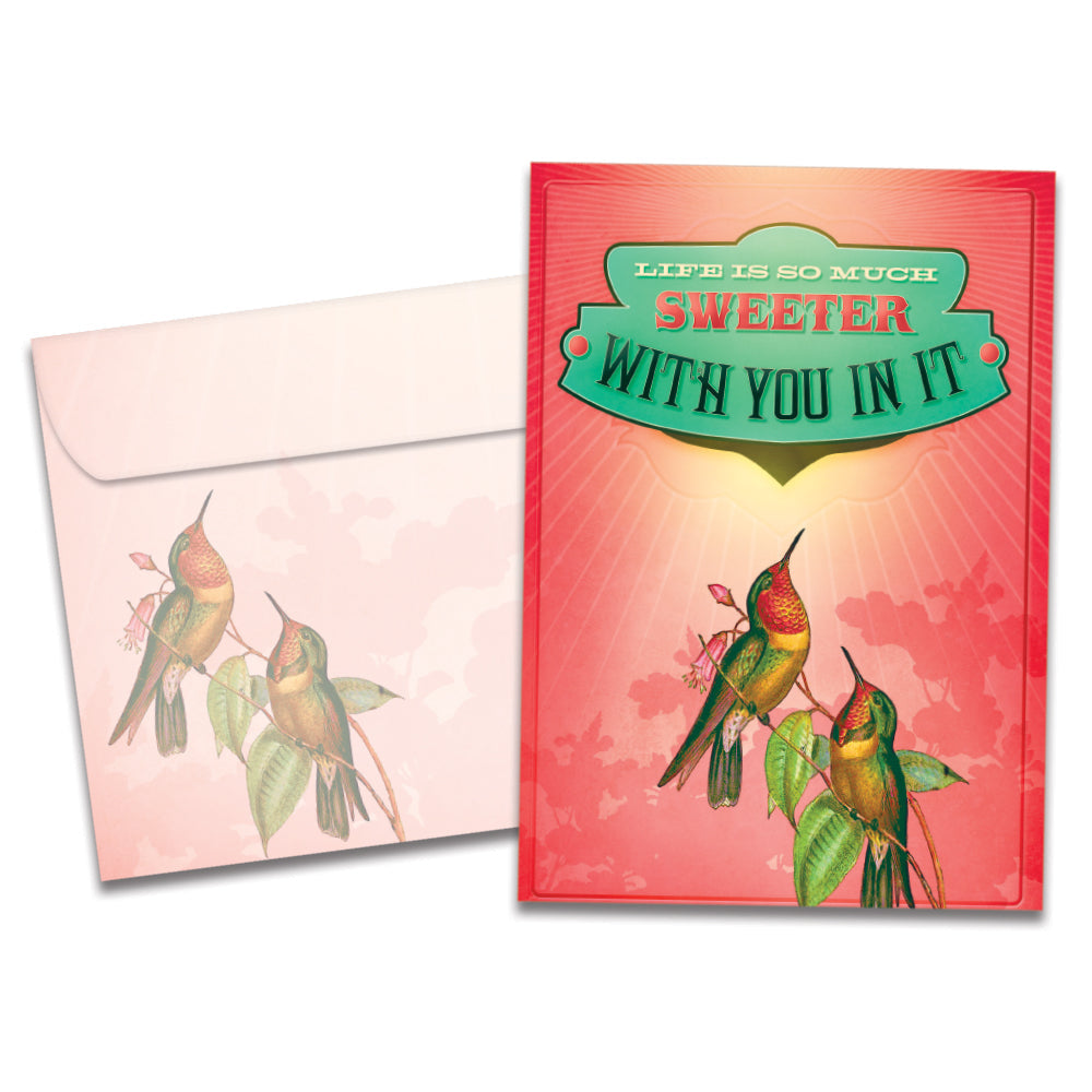 The cover of Tree-Free's Life Is Sweeter Love Card card, along with its matching envelope.