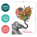 Load image into Gallery viewer, The cover of Tree-Free’s Love Elephant Valentine card with lines demonstrating its 5x7 dimensions, along with the following text: “100% PCW recycled paper, proudly made in the USA, sustainably printed on extra-thick card stock”
