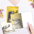 Load image into Gallery viewer, The inside of Tree-Free’s Believe In You Unicorn card, with the cover and envelope in the background.
