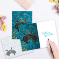 Load image into Gallery viewer, The inside of Tree-Free’s Sea Turtle Pals Friendship Card card, with the cover and envelope in the background.
