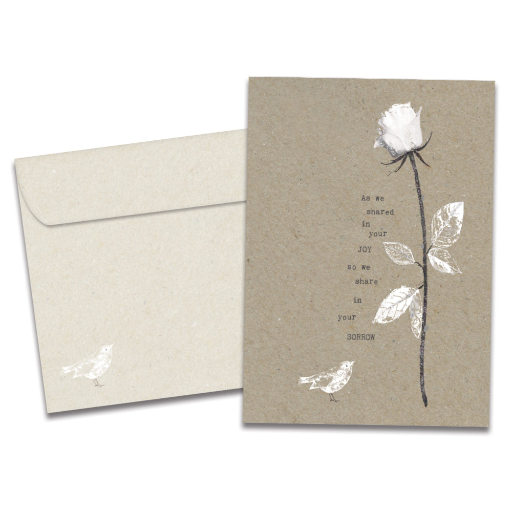 The cover of Tree-Free's Joy and Sorrow card, along with its matching envelope.