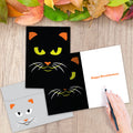 Load image into Gallery viewer, The inside of Tree-Free’s Graphic Halloween Cat Halloween Card card, with the cover and envelope in the background.
