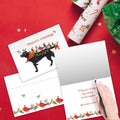 Load image into Gallery viewer, The inside of Tree-Free’s Bird Dog Christmas card, with the cover and envelope in the background.
