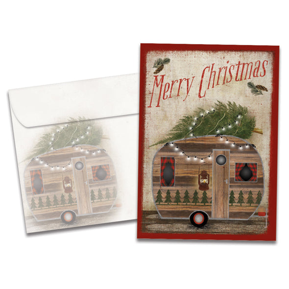 The cover of Tree-Free's Rustic Camper Christmas Christmas Card card, along with its matching envelope.