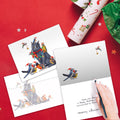 Load image into Gallery viewer, The inside of Tree-Free’s Cat Bird Christmas Christmas Card card, with the cover and envelope in the background.
