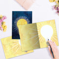 Load image into Gallery viewer, The inside of Tree-Free’s Brighten My World card, with the cover and envelope in the background.
