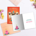 Load image into Gallery viewer, The inside of Tree-Free’s Pugs And Kisses card, with the cover and envelope in the background.
