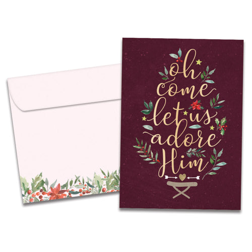 The cover of Tree-Free's Adore Him Christmas Card card, along with its matching envelope.