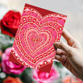 Load image into Gallery viewer, Lifestyle image(s) featuring Tree-Free’s Layers of Hearts card
