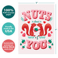 Load image into Gallery viewer, The cover of Tree-Free’s Nuts About You Valentine&#39;s Day Card card with lines demonstrating its 5x7 dimensions, along with the following text: “100% PCW recycled paper, proudly made in the USA, sustainably printed on extra-thick card stock”
