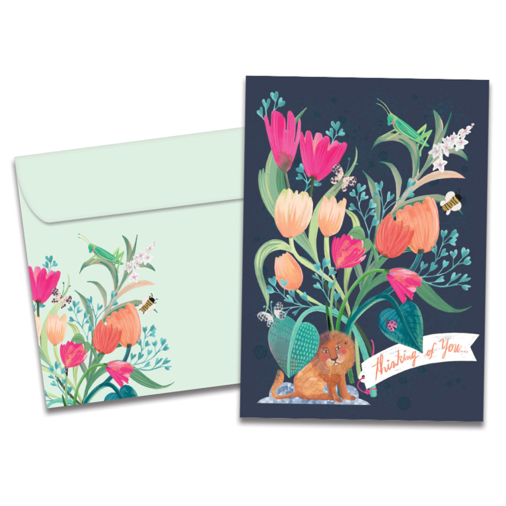 The cover of Tree-Free's Lion Floral Bouquet card, along with its matching envelope.