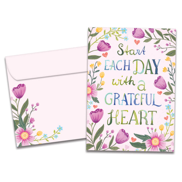 The cover of Tree-Free's Grateful Heart Floral card, along with its matching envelope.