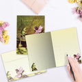 Load image into Gallery viewer, The inside of Tree-Free’s Fairy and Frog card, with the cover and envelope in the background.
