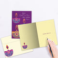 Load image into Gallery viewer, The inside of Tree-Free’s Light and Love card, with the cover and envelope in the background.
