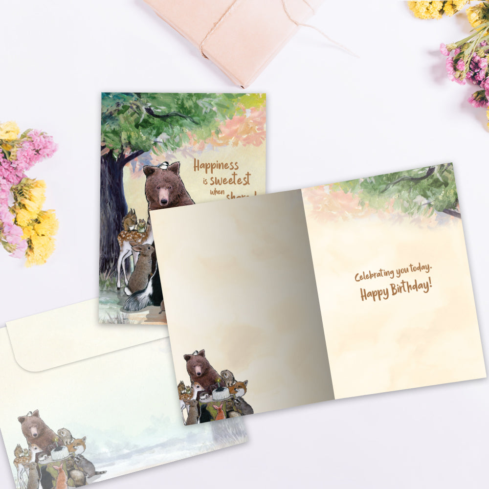 The inside of Tree-Free’s Sweetest When Shared card, with the cover and envelope in the background.