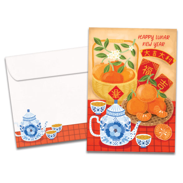 The cover of Tree-Free's Lucky Tea Set card, along with its matching envelope.