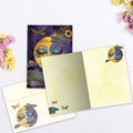 Load image into Gallery viewer, The inside of Tree-Free’s Serene Moon card, with the cover and envelope in the background.
