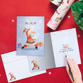 Load image into Gallery viewer, The inside of Tree-Free’s Ho Ho Ohm card, with the cover and envelope in the background.
